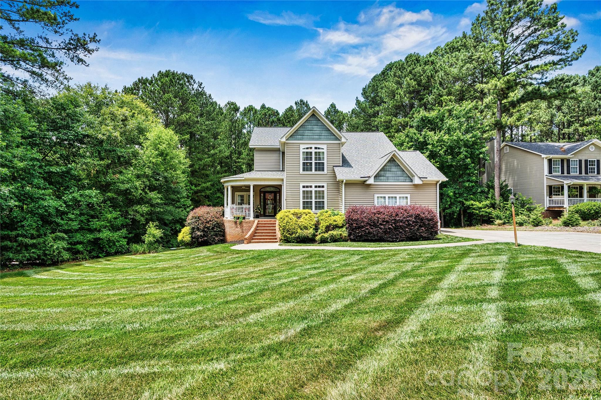 1606 High Ridge Drive Stanley, NC 28164 - Photo 2 of 44 a front view of a house with a yard