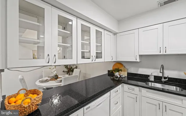 a kitchen with a sink and cabinets