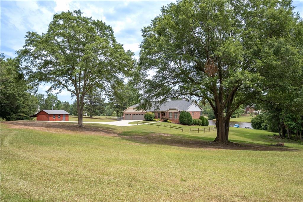 44 Maple Valley Drive Villa Rica, GA 30180 - Photo 1 of 1 a view of swimming pool with tree s