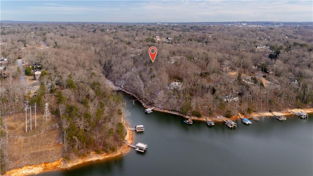 an aerial view of a houses with city view