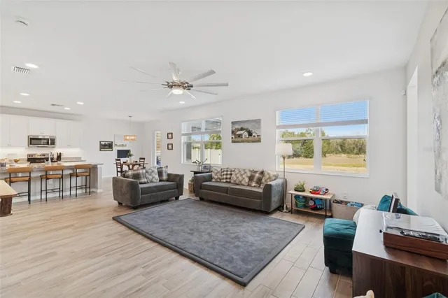 a bathroom with a granite countertop toilet sink and mirror
