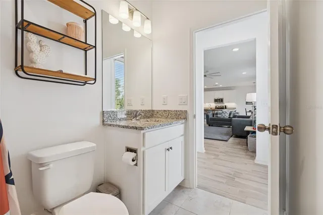 a bedroom with furniture and a ceiling fan