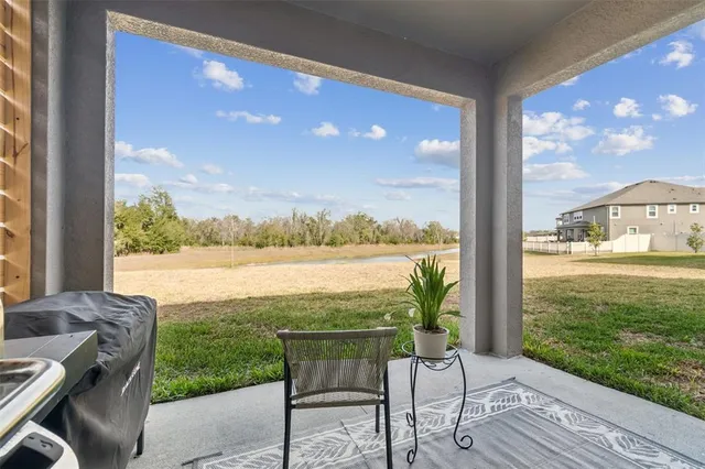 an aerial view of a houses with a swimming pool