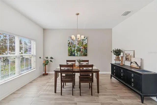 a view of a dining room with furniture window and outside view