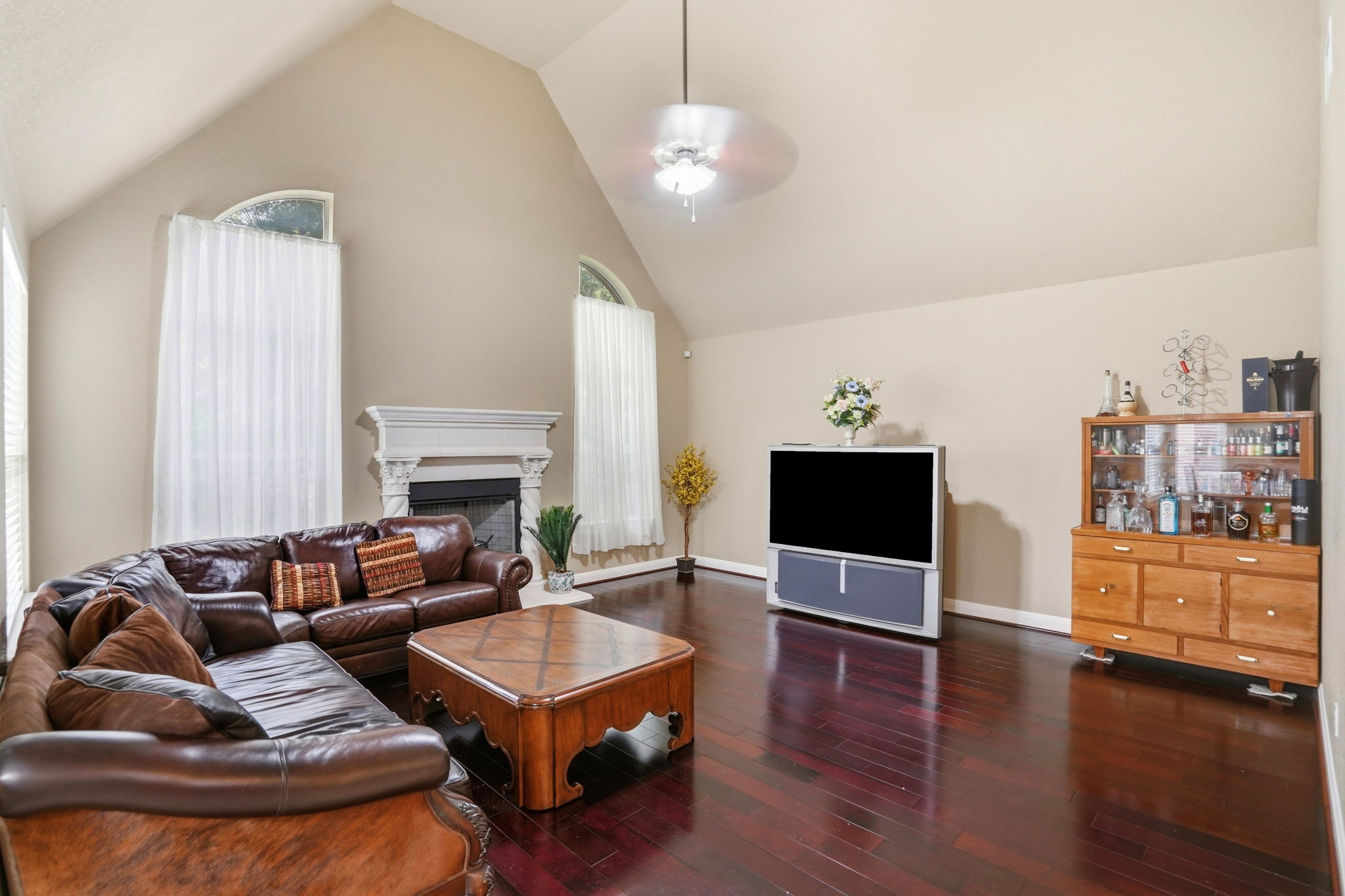 222 Vailco Lane Austin, TX 78738 - Photo 12 of 39 Vaulted ceilings enhance this living space featuring rich wood-finish flooring