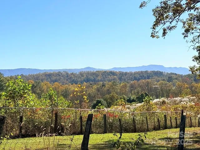 a view of a town with mountains in the background