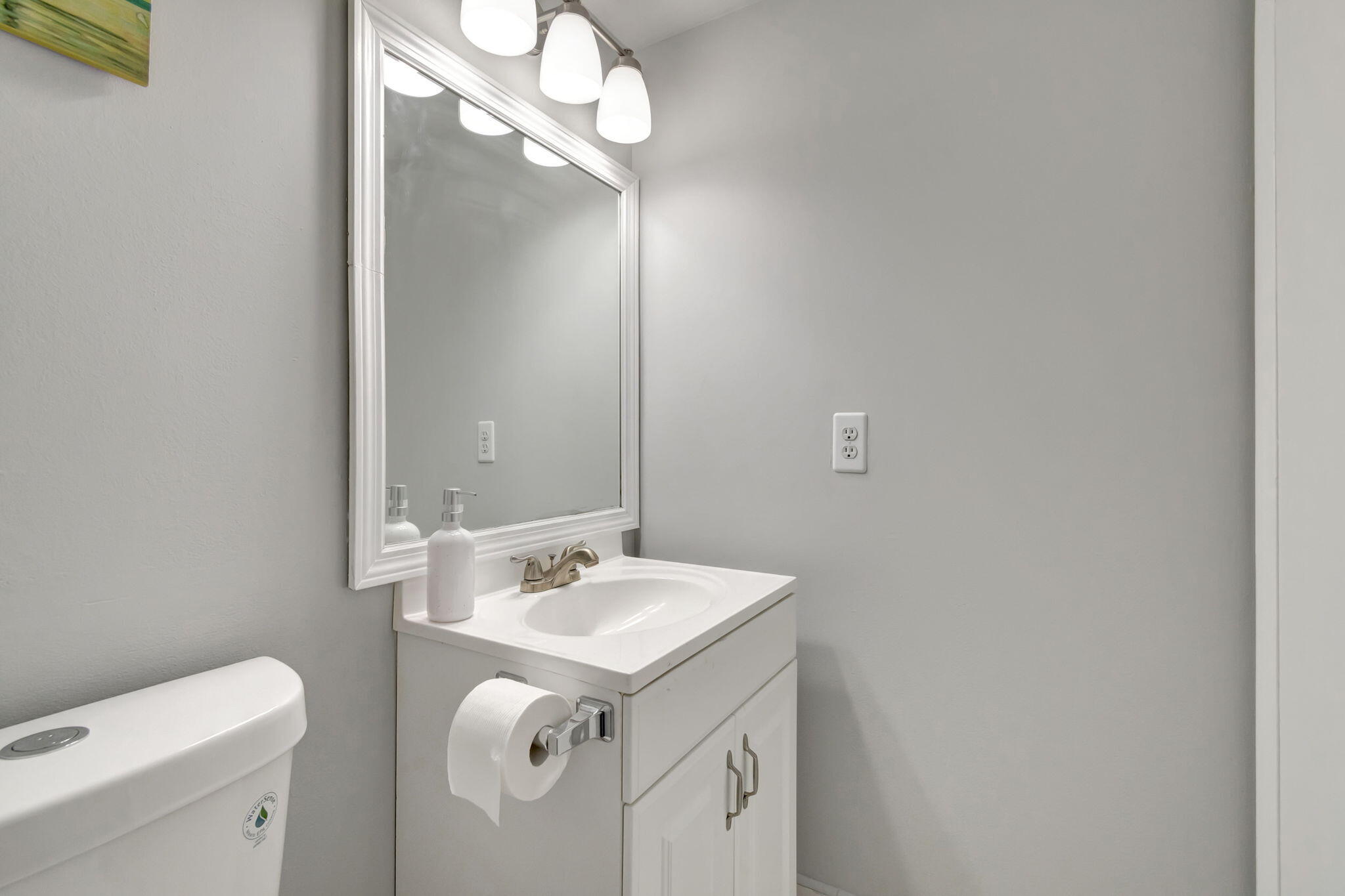 3031 Cornwall East Boca Raton, FL 33434 - Photo 14 of 84 a bathroom with a sink a toilet and a mirror