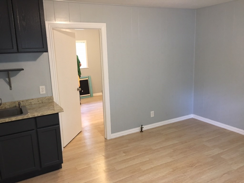 2018 Ave L 1/2, Unit 4 Huntsville, TX 77340 - Photo 2 of 6 a view of hallway with wooden floor