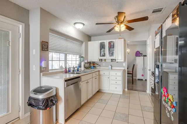 a kitchen with a cabinets and appliances