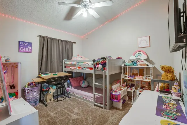 a bedroom with furniture and a chandelier