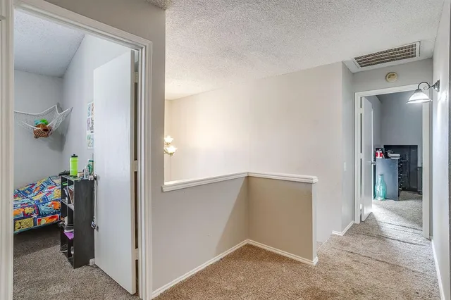 a view of a hallway view with closet