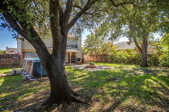 a view of a chairs with a backyard