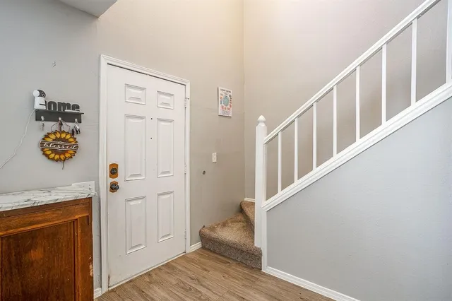 a view of entryway with wooden floor