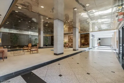 a lobby with furniture and floor