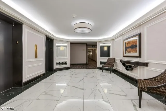 a lobby with furniture and window