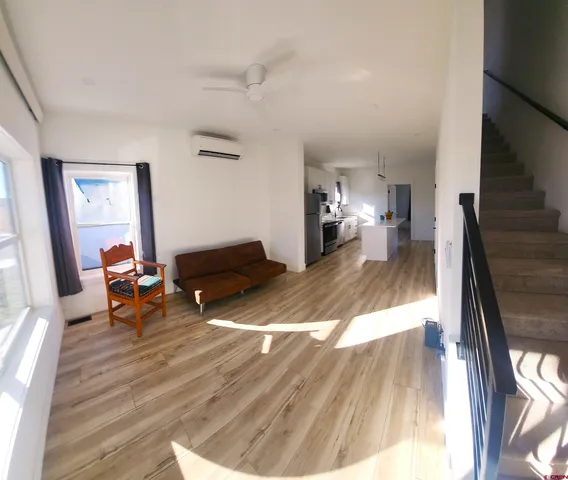 a view of a hallway view with staircase