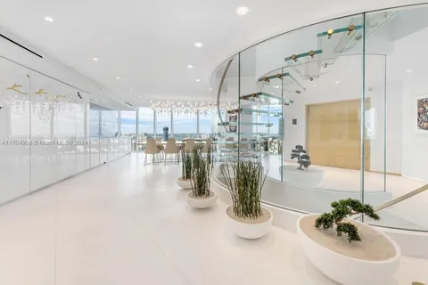 a room with lots of counter space and a view of living room