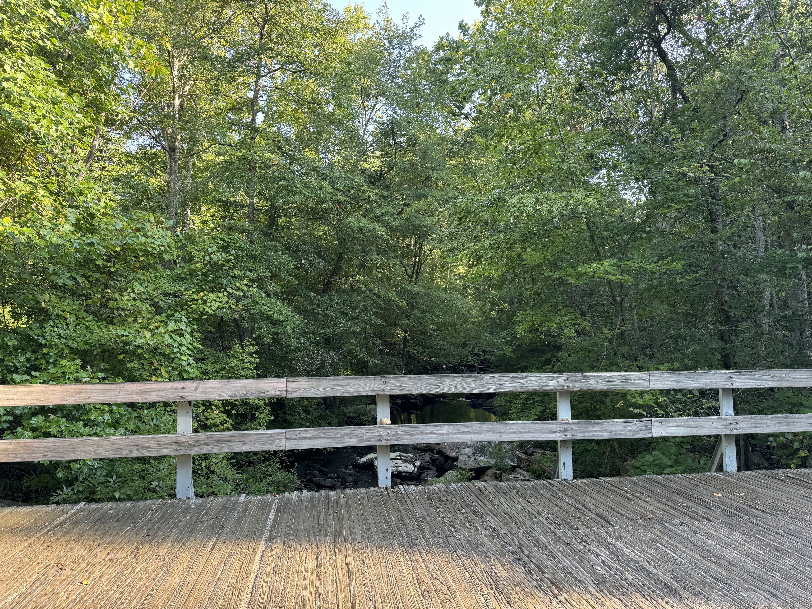 48 A Ironworks Road Clinton, CT 06413 - Photo 3 of 10 a view of balcony with wooden floor