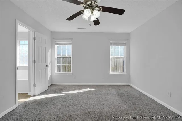 an empty room that has a window in it