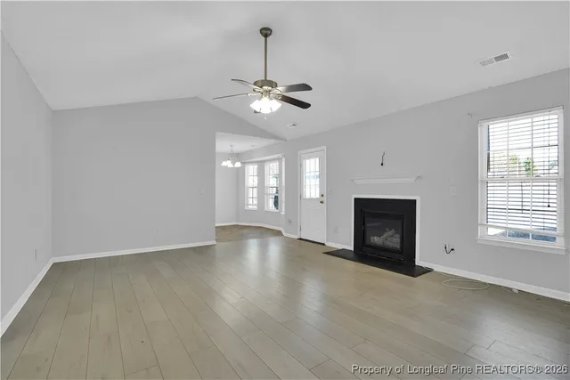 a kitchen with stainless steel appliances granite countertop a stove and a microwave