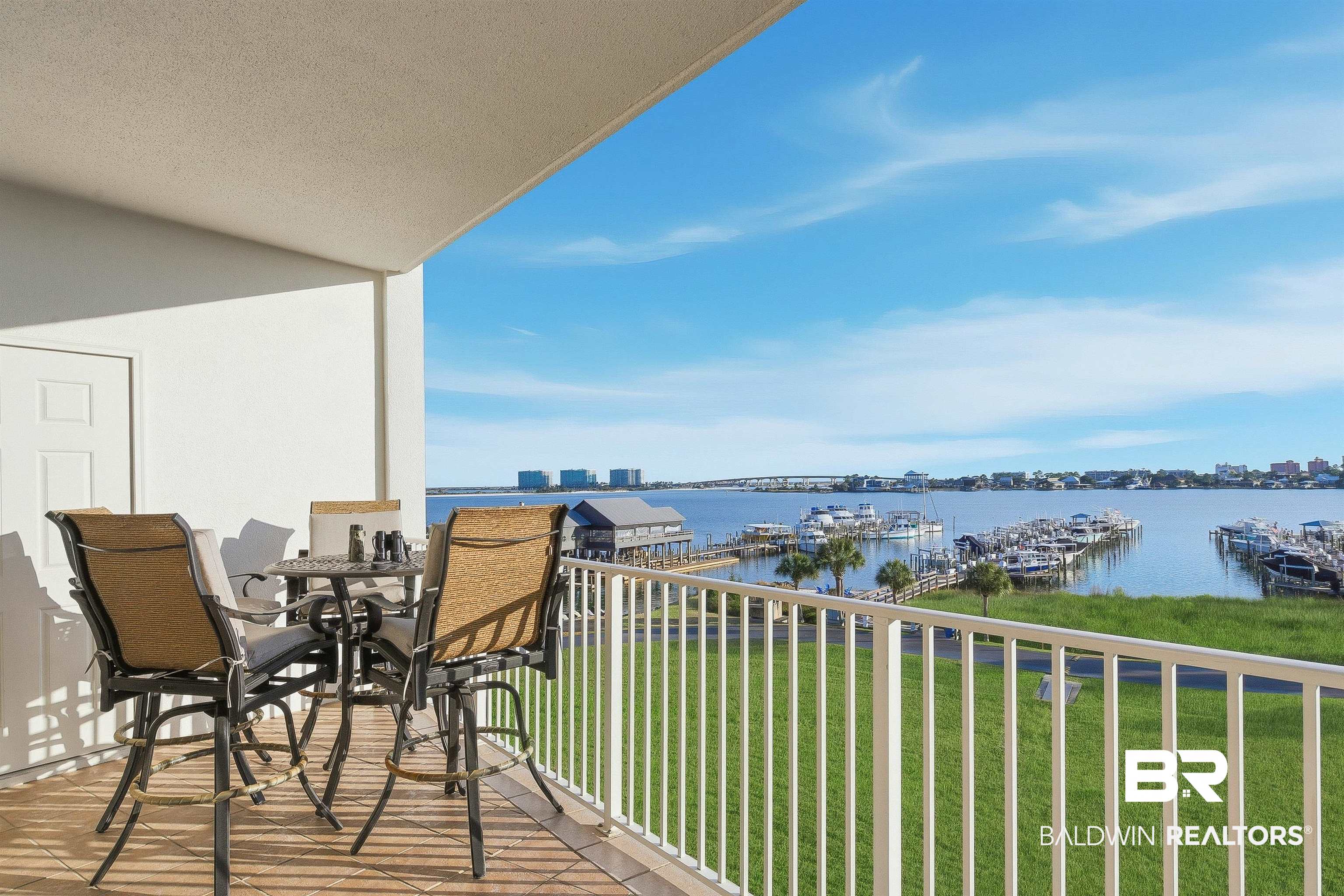 27282 Canal Road, Unit 408 Orange Beach, AL 36561 - Photo 19 of 37 Balcony with view of marina, a water view, and outdoor dining space