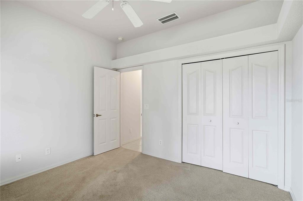 680 West Doerr Path Hernando, FL 34442 - Photo 14 of 48 an empty room with a ceiling fan & entryway