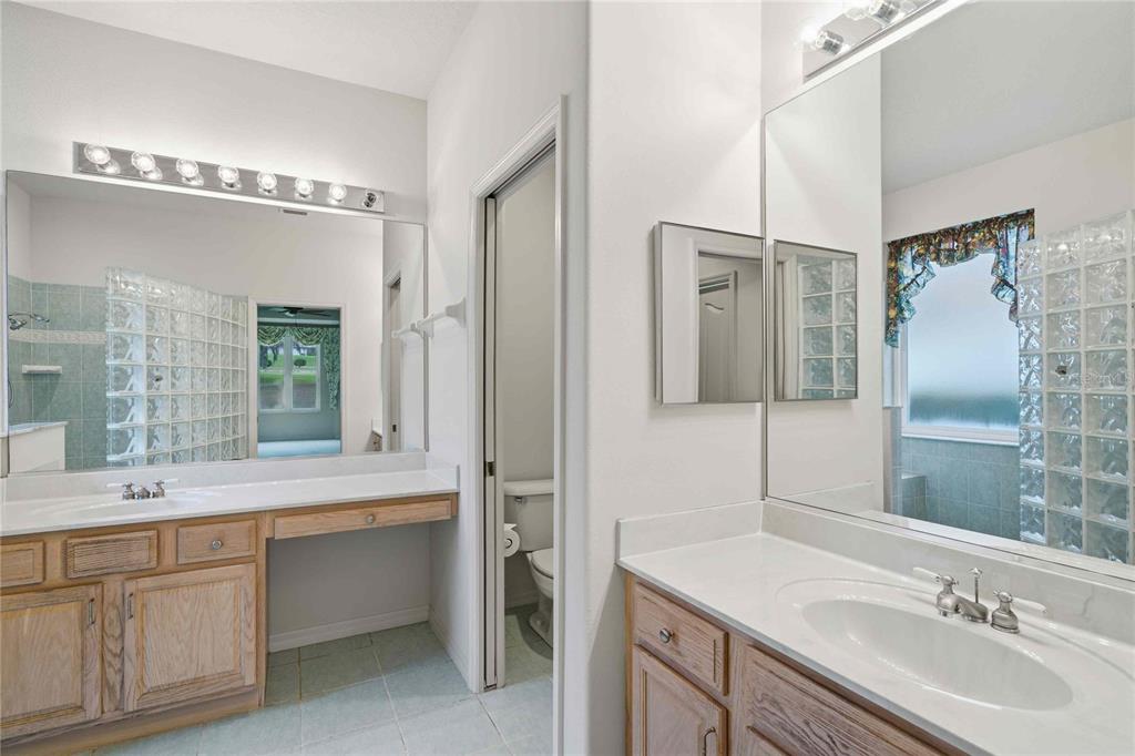 680 West Doerr Path Hernando, FL 34442 - Photo 31 of 48 a bathroom with a sink double vanity and a mirror