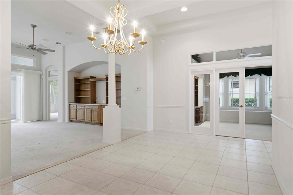 680 West Doerr Path Hernando, FL 34442 - Photo 7 of 48 a view of a hallway with a chandelier and chandelier