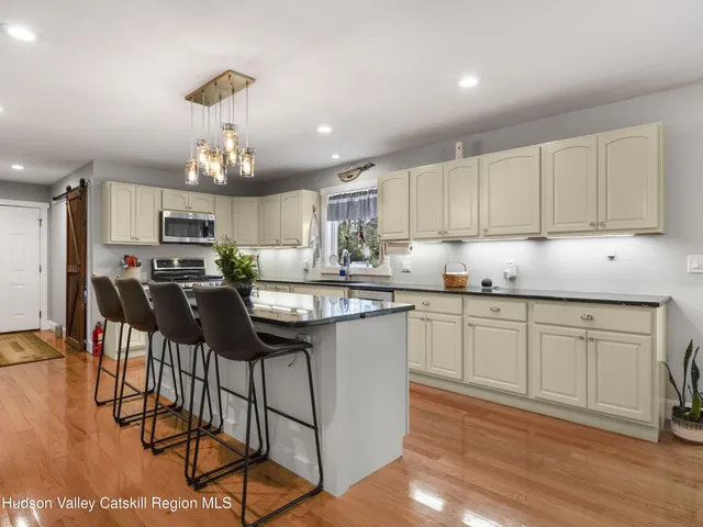 a view of a deck with furniture and a yard