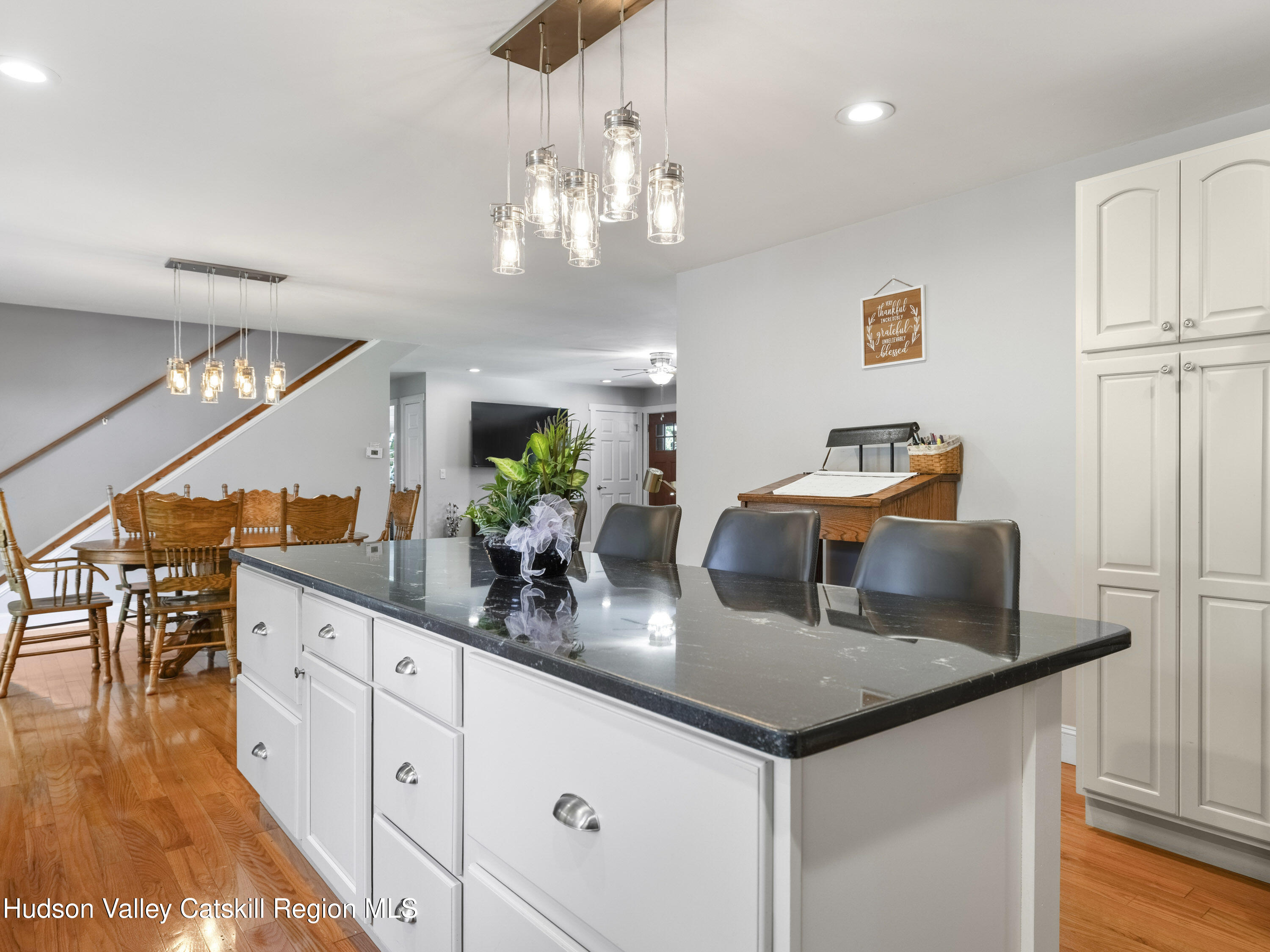 15 Pine Street Cairo, NY 12413 - Photo 21 of 46 a kitchen with center island table and chairs