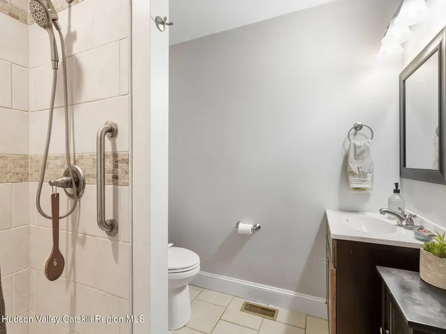 a view of a house with sitting area and garden