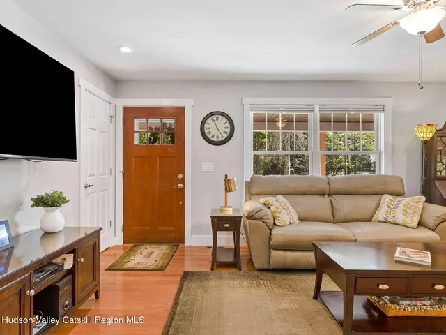 a kitchen with a sink stainless steel appliances and white cabinets