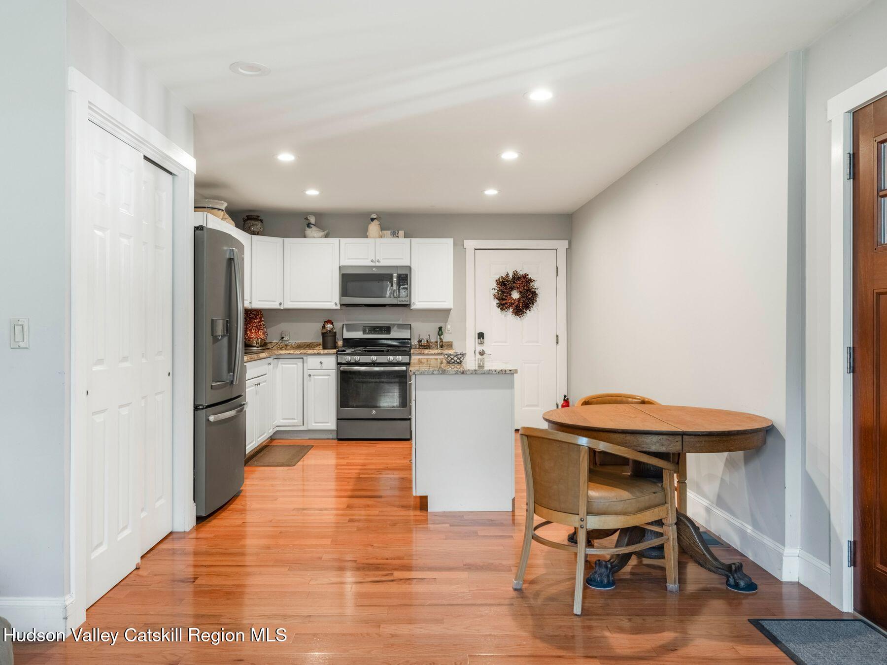 15 Pine Street Cairo, NY 12413 - Photo 30 of 46 a kitchen with a sink stainless steel appliances and white cabinets