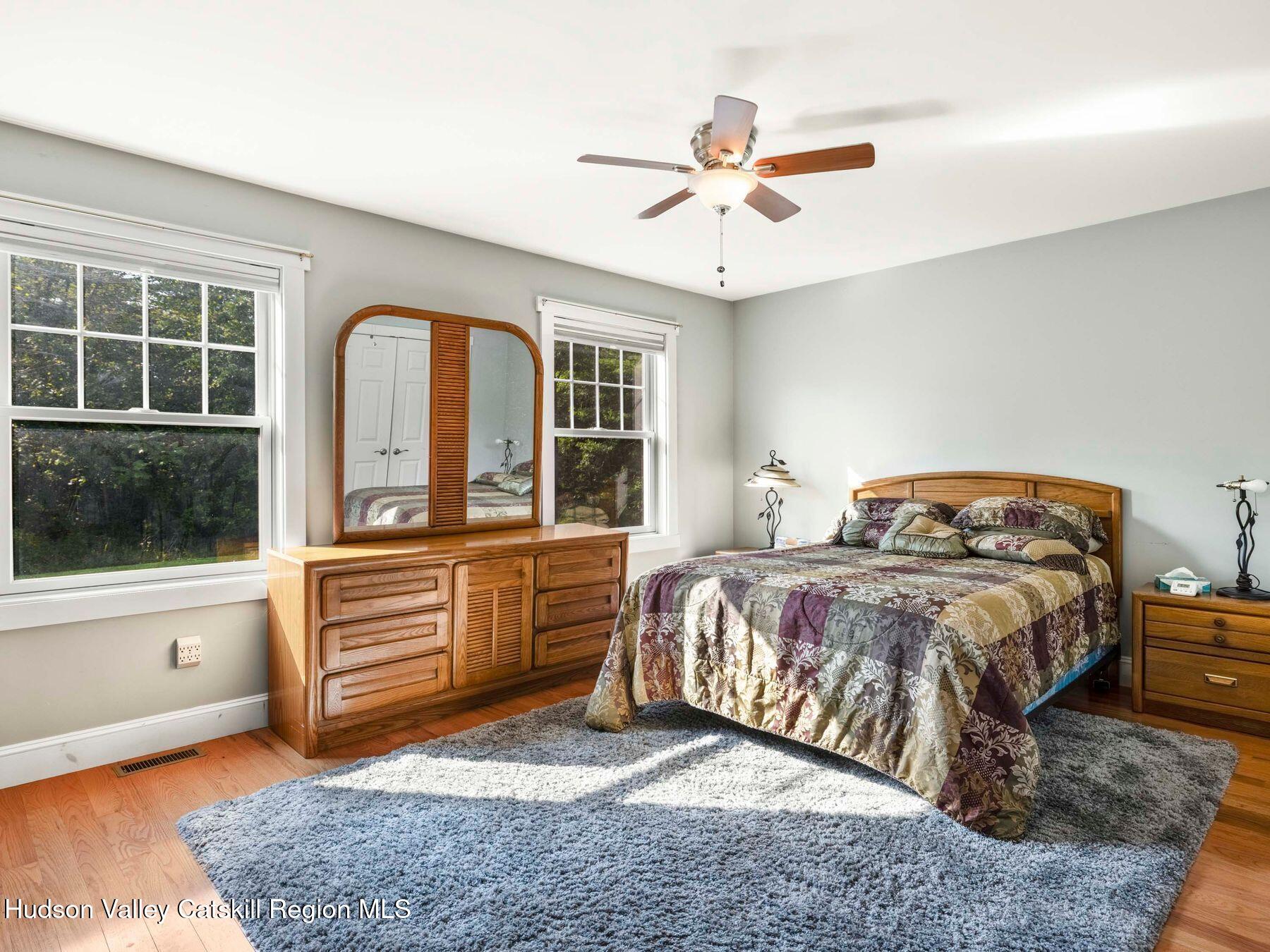 15 Pine Street Cairo, NY 12413 - Photo 32 of 46 a bedroom with a bed and a large window