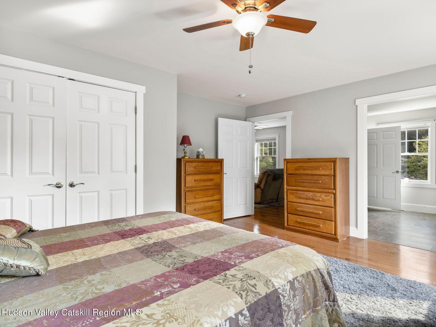 15 Pine Street Cairo, NY 12413 - Photo 33 of 46 a bedroom with a bed and a chandelier