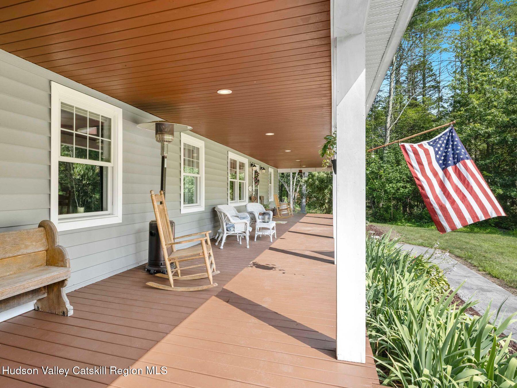 15 Pine Street Cairo, NY 12413 - Photo 6 of 46 a porch area with table and chairs