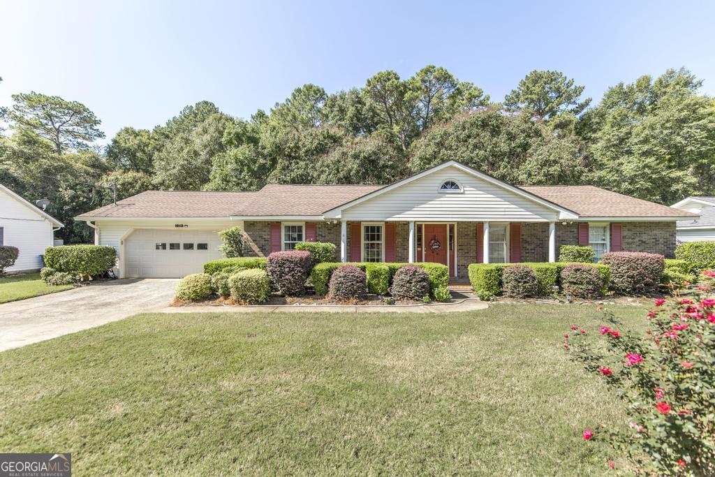 1013 North Davis Drive Perry, GA 31069 - Photo 1 of 1 a front view of a house with a yard