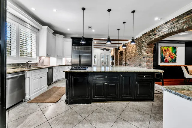 a living room with fireplace furniture and a wooden floor