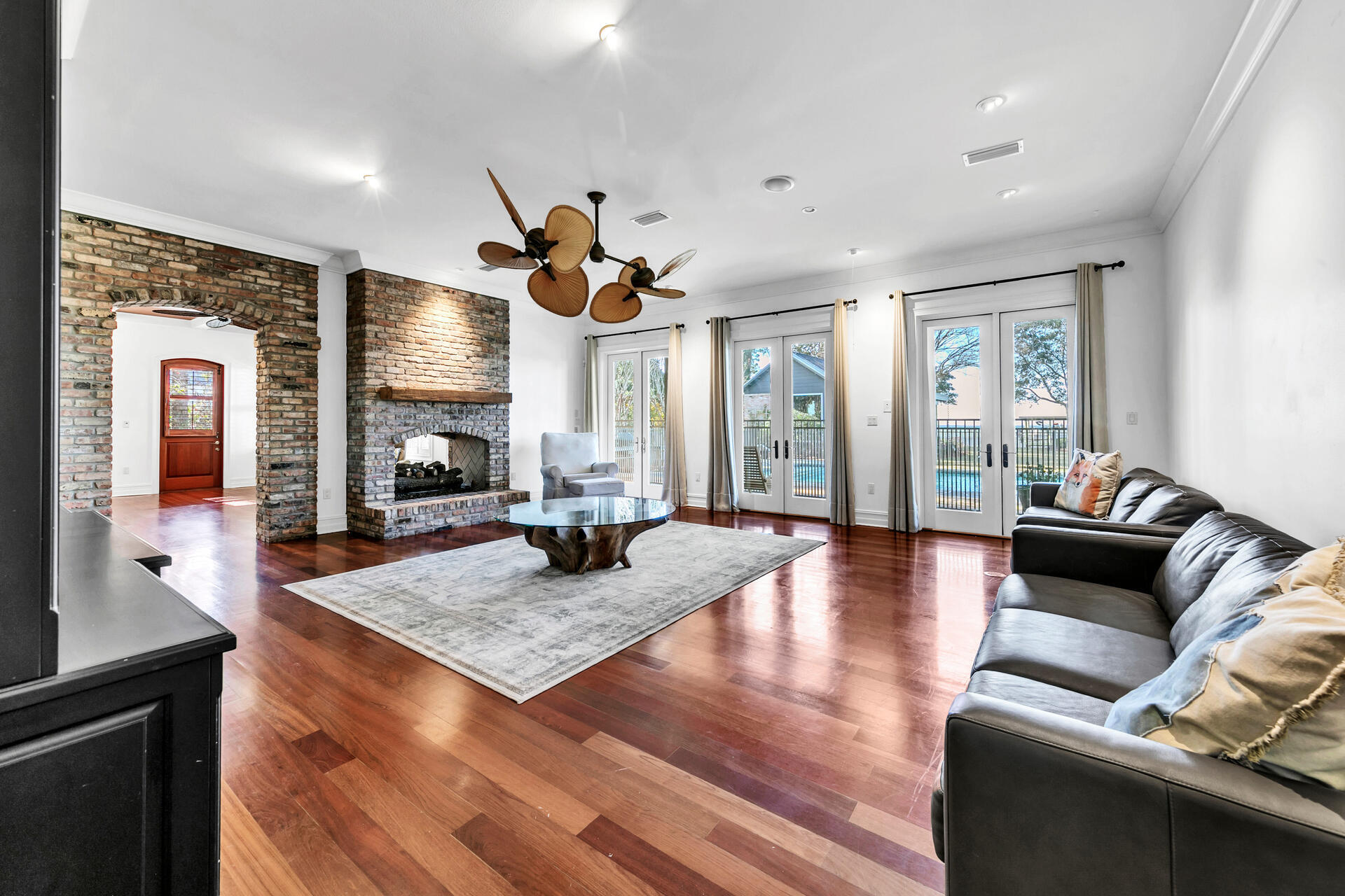 389 Driftwood Point Road Santa Rosa Beach, FL 32459 - Photo 23 of 79 a living room with fireplace furniture and a wooden floor