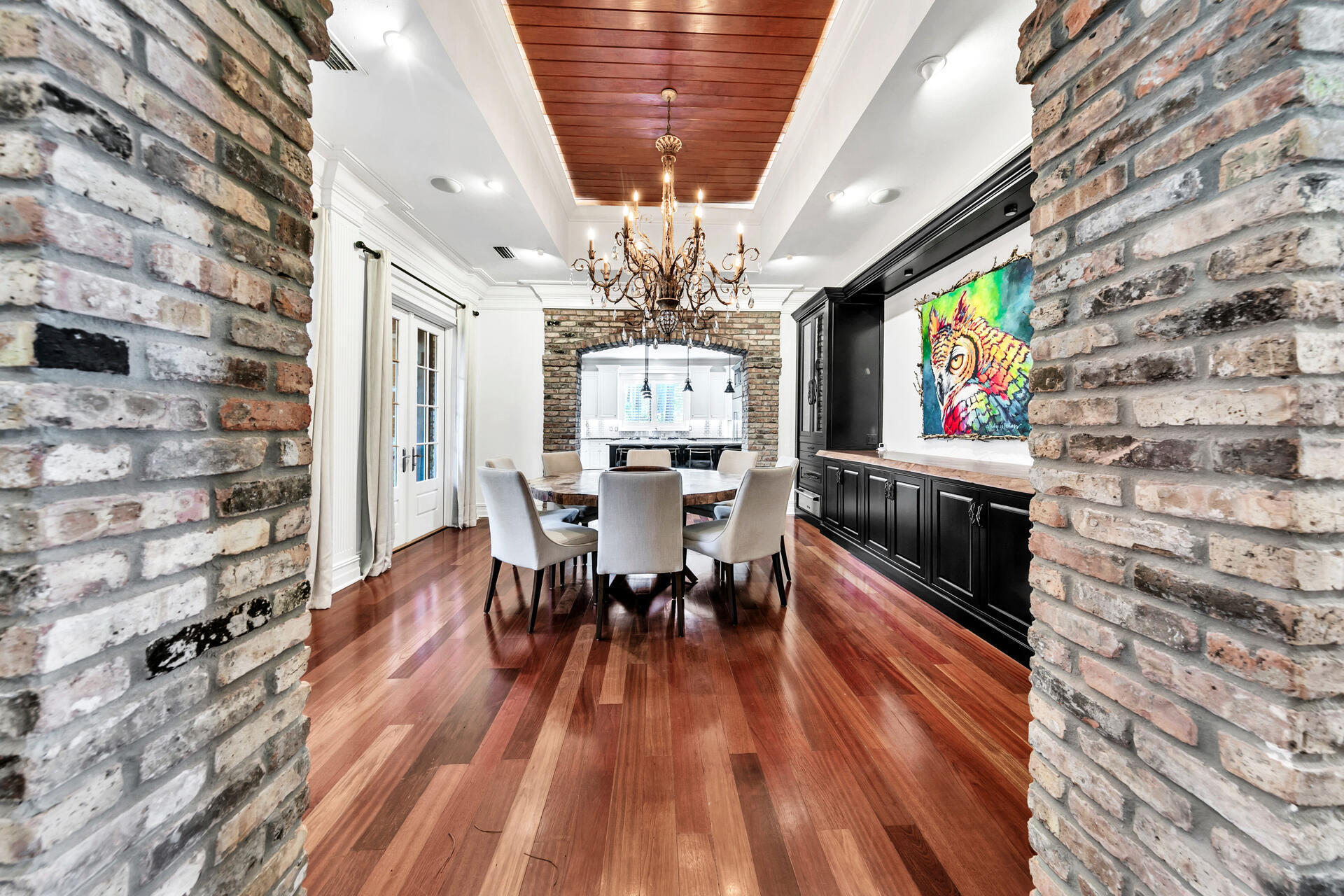 389 Driftwood Point Road Santa Rosa Beach, FL 32459 - Photo 24 of 79 a view of a dining room with furniture a chandelier and wooden floor
