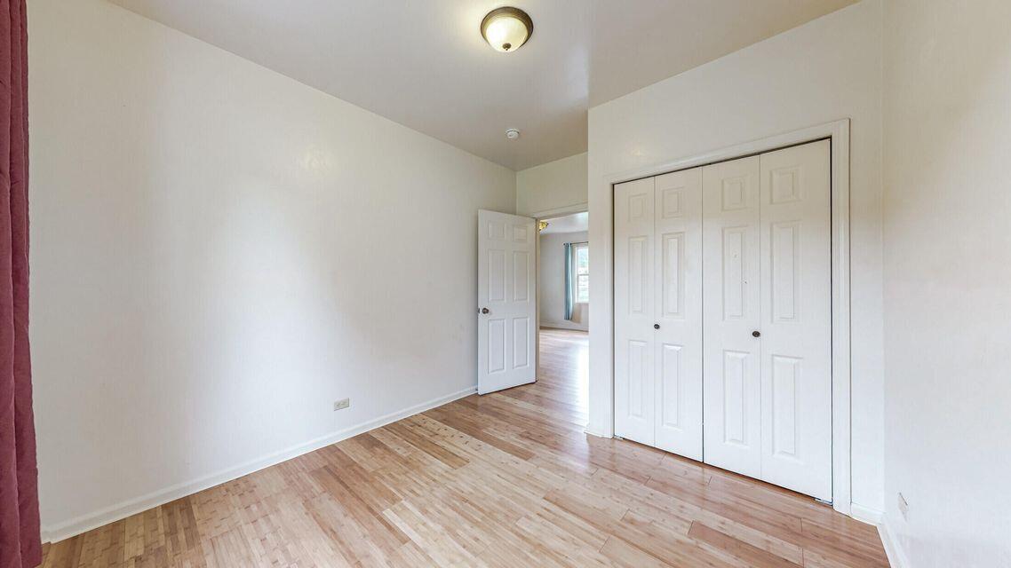 111 Monument Road Rio Dell, CA 95562 - Photo 12 of 26 a view of an empty room with wooden floor and a window