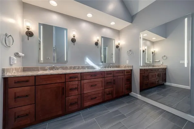 a bathroom with double vanity and a double vanity sink