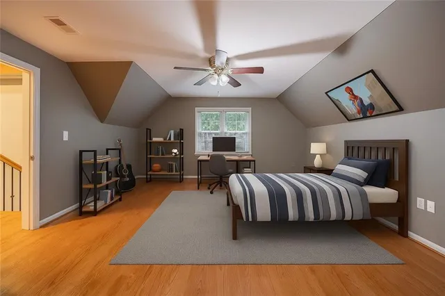 a living room with furniture a chandelier and a flat screen tv