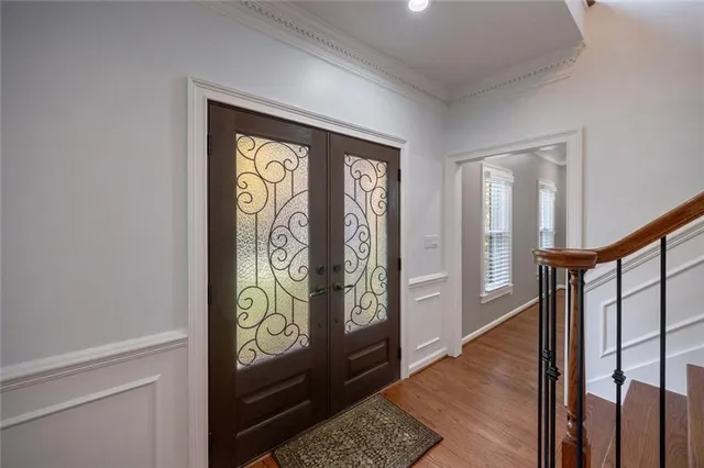 a view of front door with wooden floor