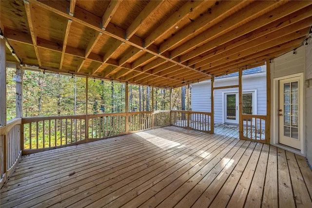 a view of porch with wooden floor