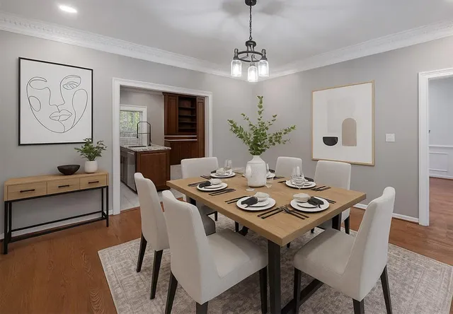 a view of a dining room with furniture window and wooden floor