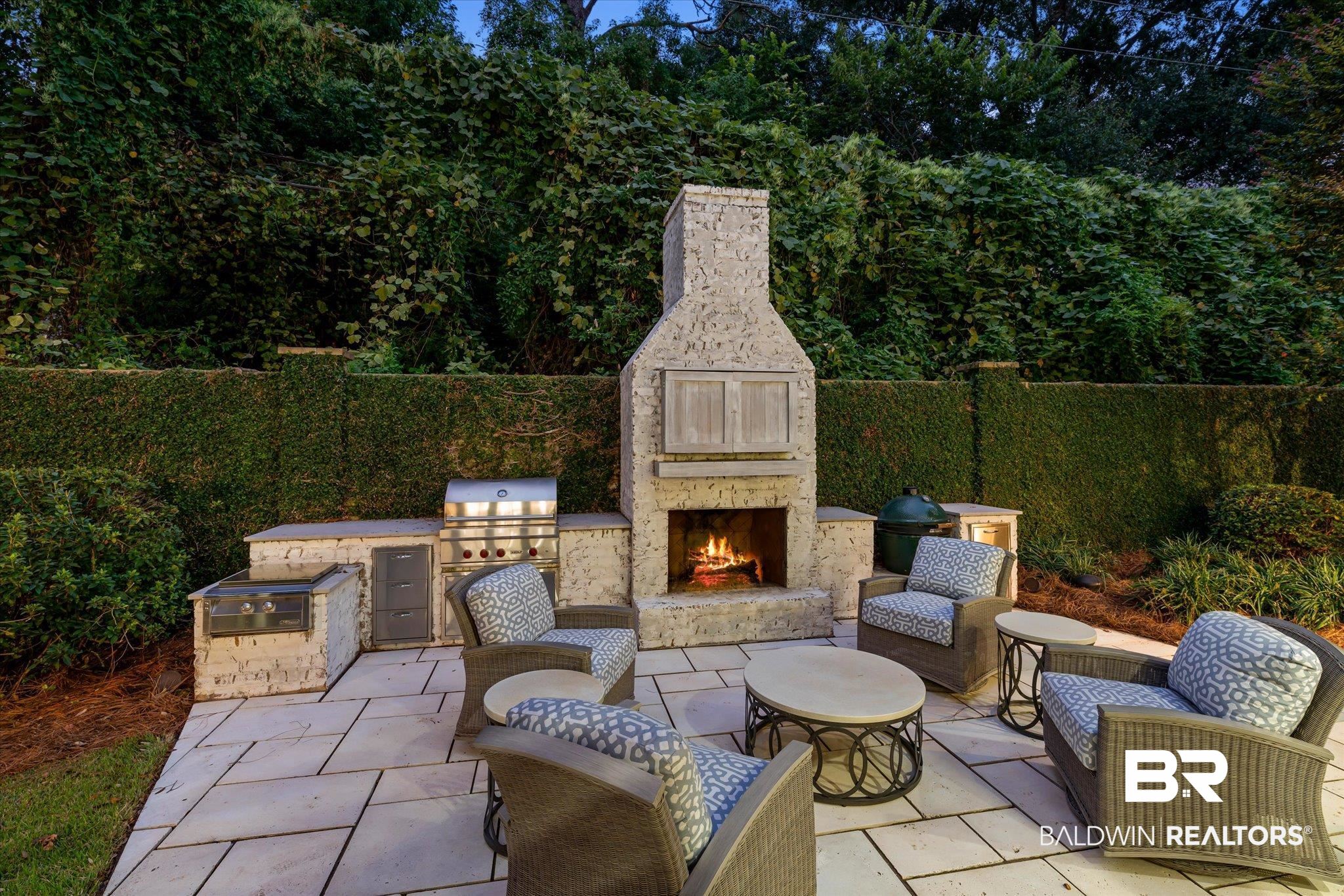 320 Long Court Mobile, AL 36608 - Photo 55 of 61 View of patio / terrace featuring an outdoor stone fireplace and an outdoor kitchen