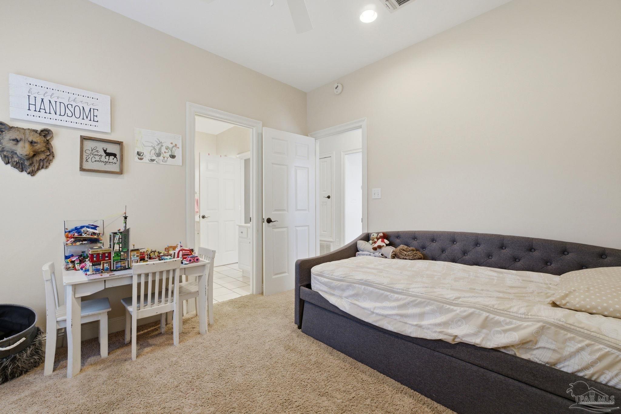 5931 Otter Point Road Pensacola, FL 32504 - Photo 29 of 67 a bedroom with a bed and a table