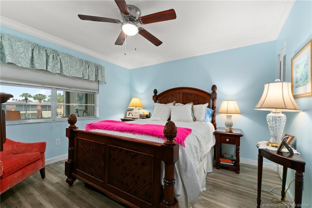 1985 Southwest Palm City Road, Unit 44I Stuart, FL 34994 - Photo 16 of 31 a living room with a bed furniture and a window
