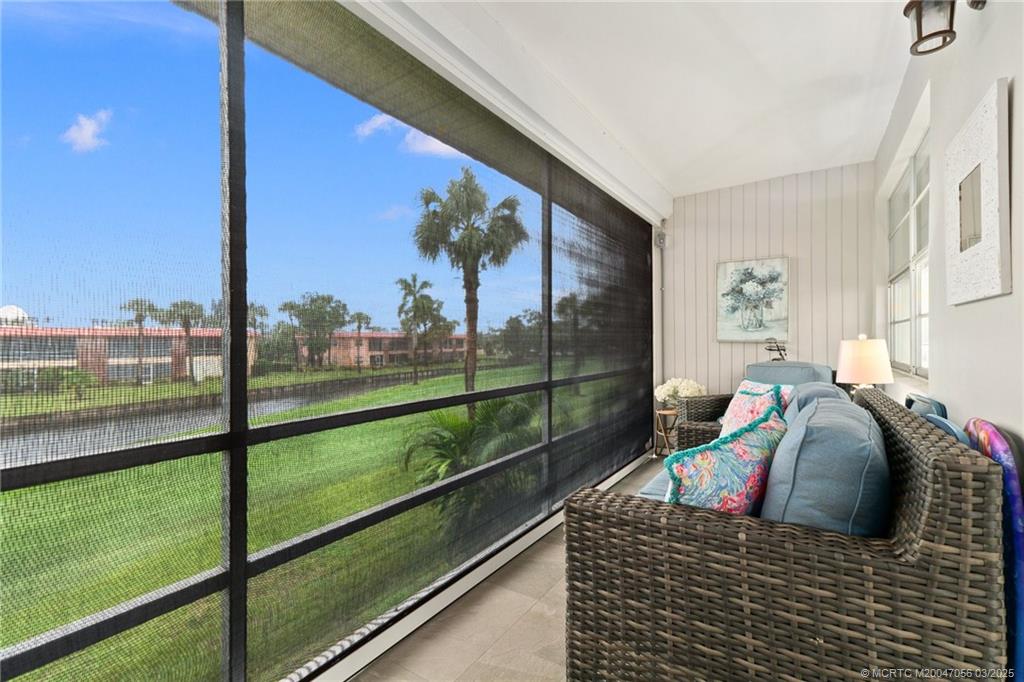 1985 Southwest Palm City Road, Unit 44I Stuart, FL 34994 - Photo 22 of 31 a view of a living room and floor to ceiling window